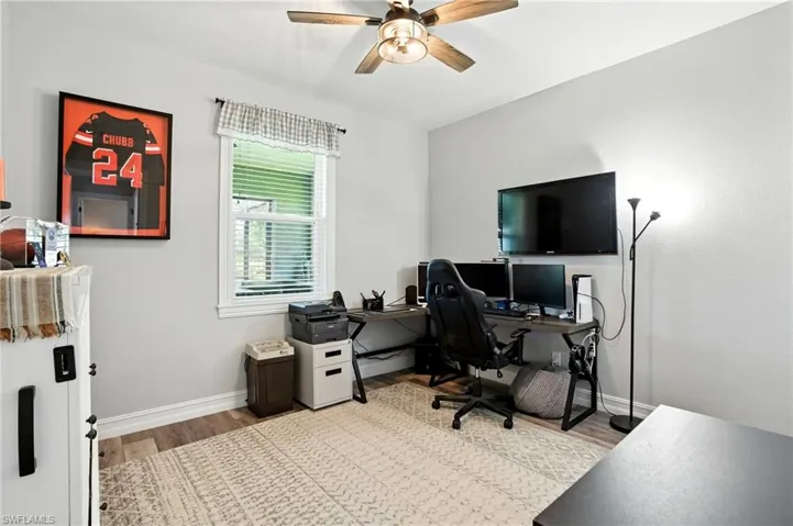 Office featuring light wood-style flooring and ceiling fan