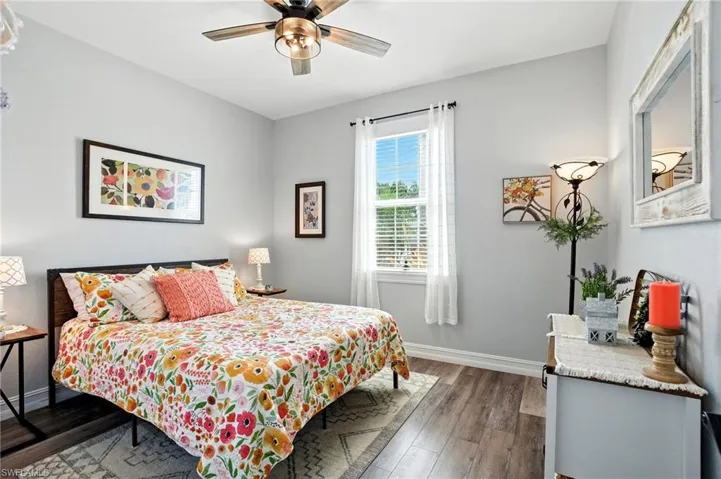 Bedroom with wood finished floors and ceiling fan