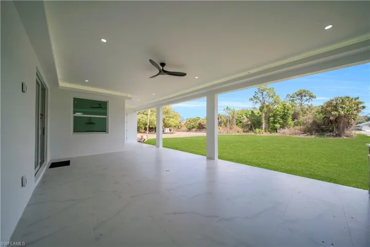 View of patio featuring ceiling fan