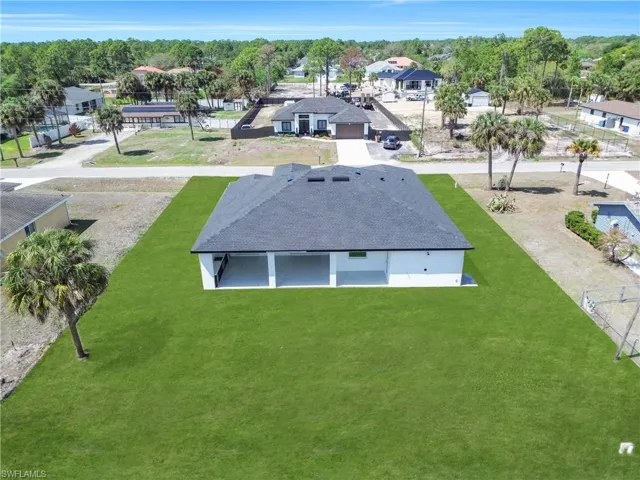Aerial perspective of suburban area featuring a tree filled landscape