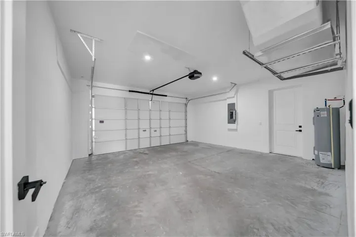 Garage with water heater and electric panel