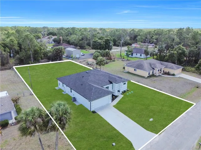 Aerial perspective of suburban area with a tree filled landscape