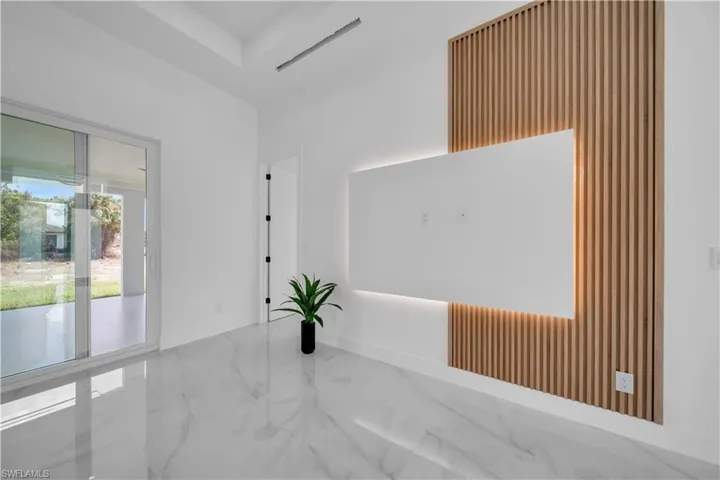 Spare room featuring baseboards