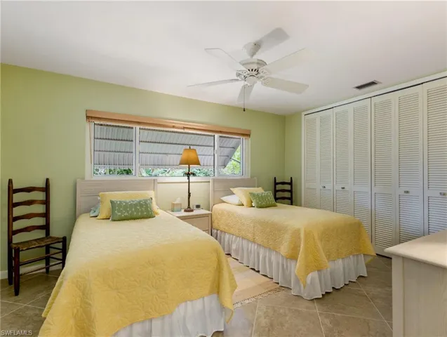 2nd Guest Bedroom with a wall of closet space