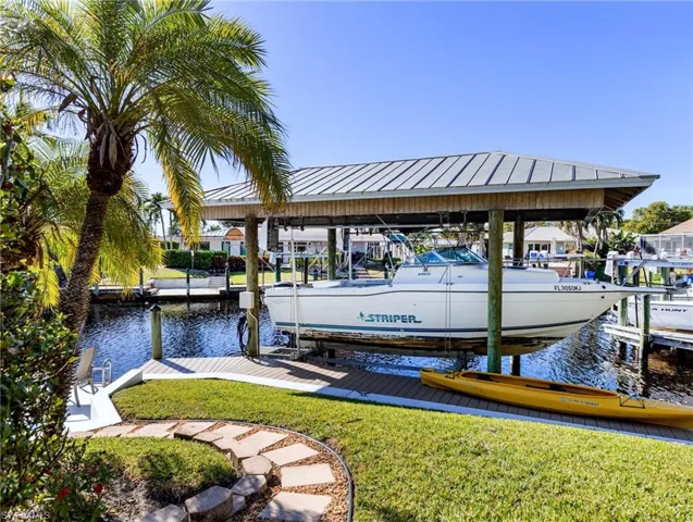 Boat lift with metal roof for added protection