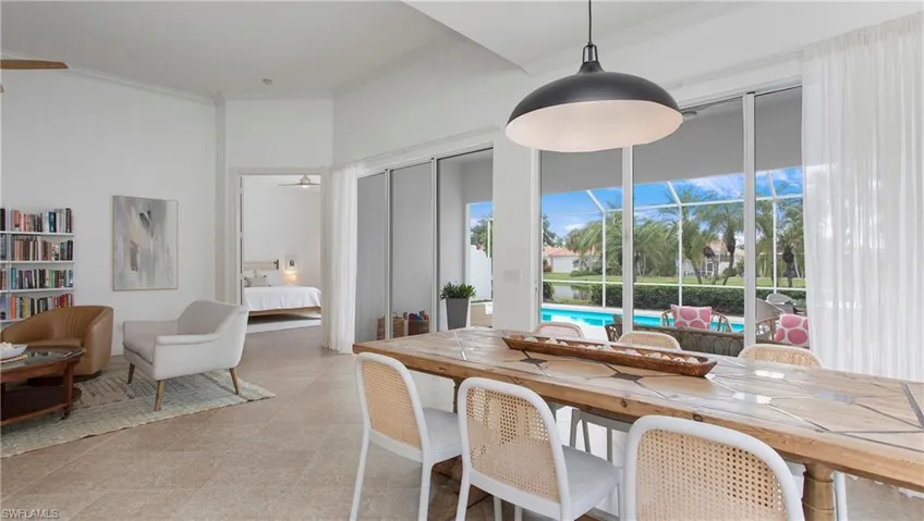 Dining area featuring ornamental molding and ceiling fan