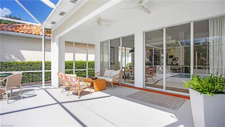 Unfurnished sunroom with ceiling fan