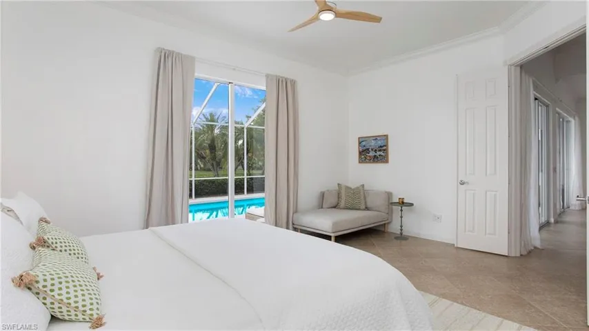 Bedroom with access to outside, ornamental molding, and ceiling fan