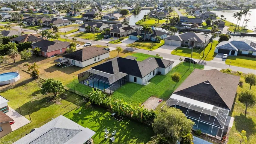 Bird's eye view featuring a water view and a residential view