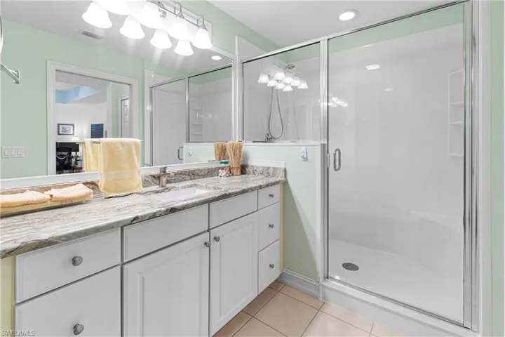 MASTER BATHROOM UPDATED WITH A WALK-IN GLASS SHOWER DOOR INSTALLED IN SEPTEMBER OF 2023 AT A COST OF $7,900.00