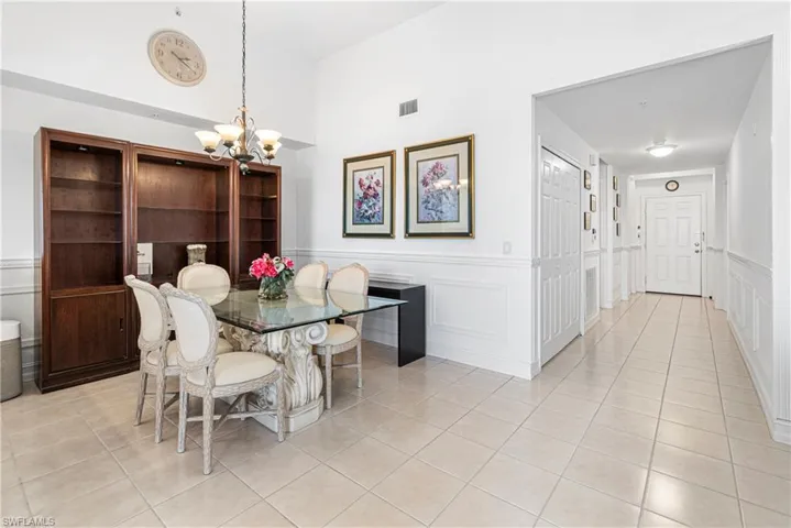 TILE SHINES LIKE NEW PLUS CHAIR RAILING IN THE DINING AREA & HALLWAY ADD CHARACTER TO THE HOME!