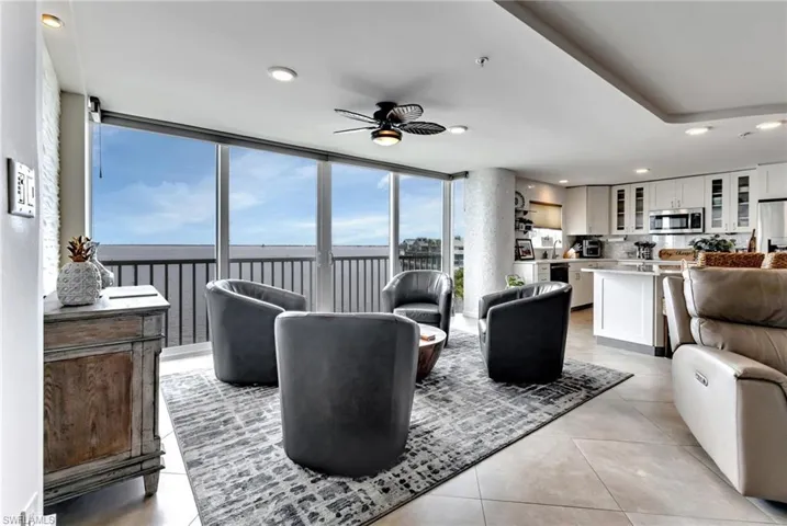 Living room with recessed lighting, a ceiling fan, and light tile patterned floors