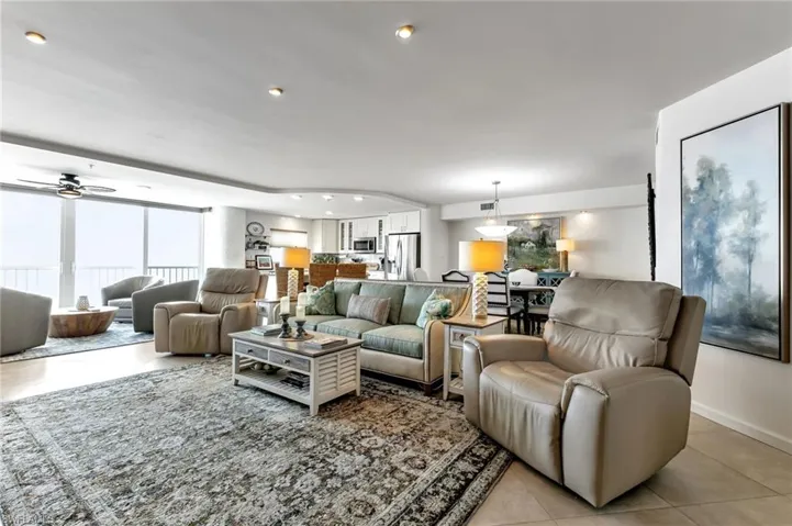 Living area featuring a ceiling fan, tile patterned floors, and recessed lighting