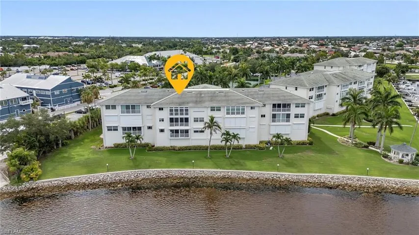 Bird's eye view of a nearby body of water and apartment complex
