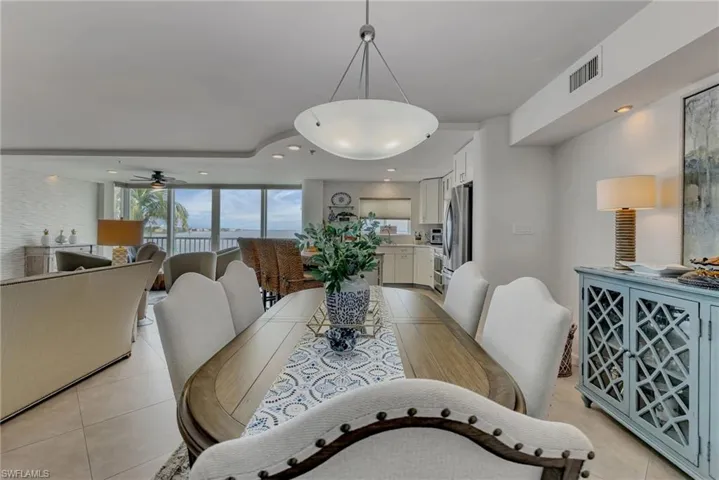 Dining space featuring recessed lighting, a ceiling fan, and light tile patterned floors