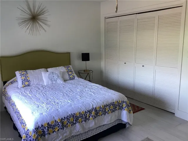 Bedroom featuring a closet and hardwood / wood-style floors