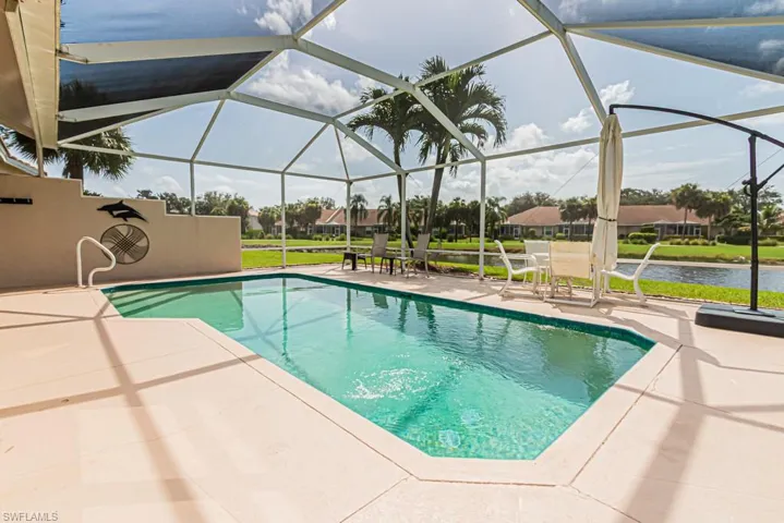 Swimming pool featuring a patio and a lanai