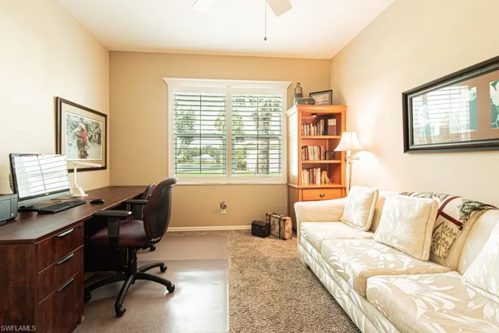 Office space featuring carpet flooring and ceiling fan