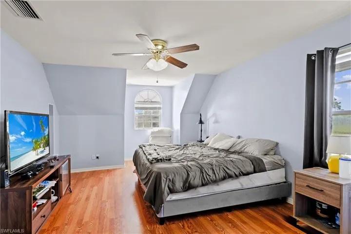 Bedroom featuring wood finished floors and a ceiling fan