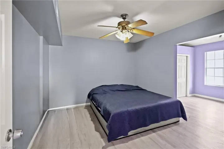 Bedroom featuring wood finished floors and ceiling fan