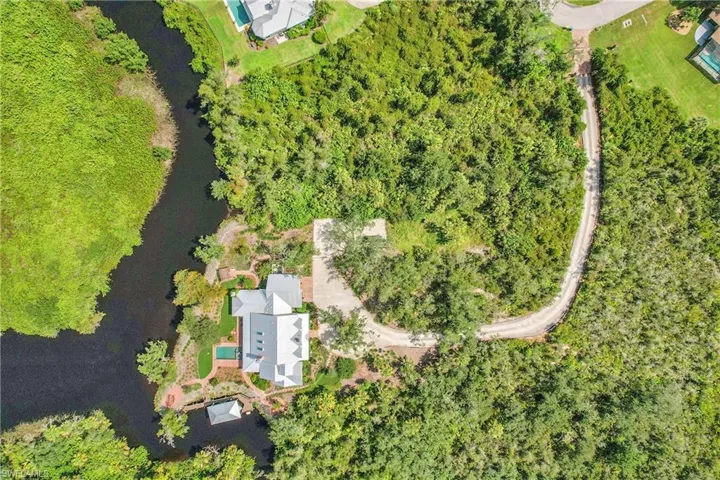 The estate is gracefully sited within 4.5 acres of private preserve, creating a secluded retreat surrounded by unspoiled lanscape