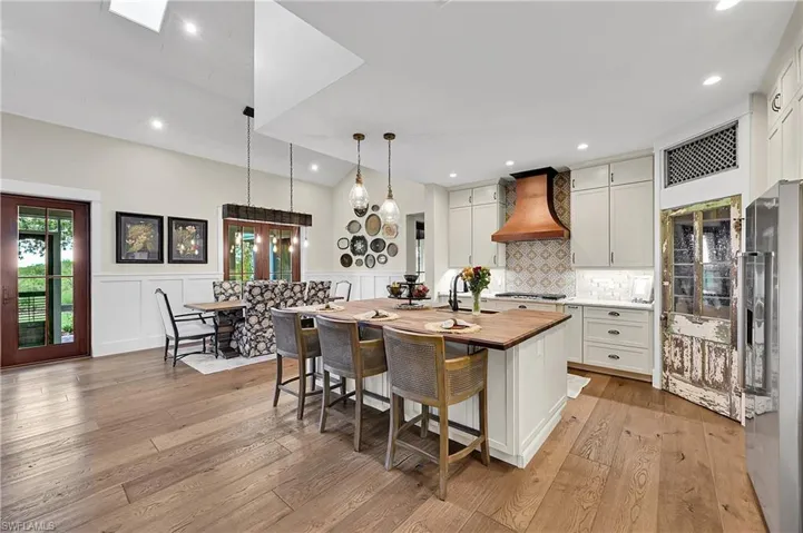 Open, airy design offers seamless sightlines to the kitchen and dining areas, creating a welcoming space for entertaining