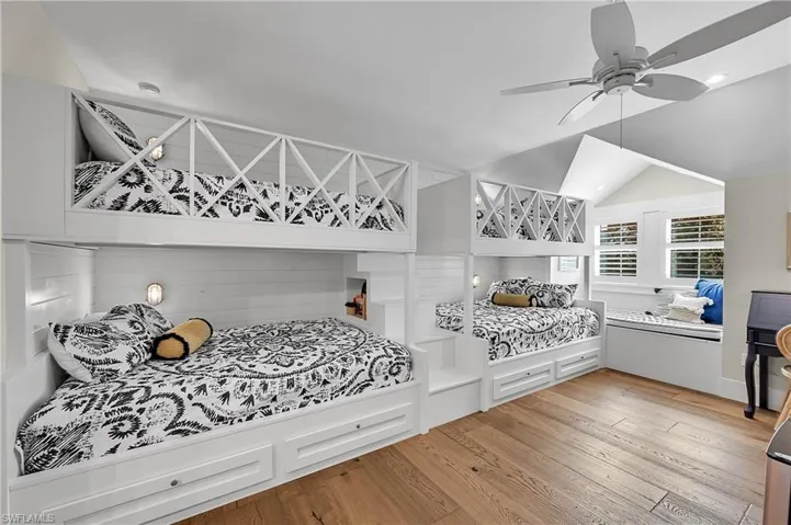 Well-designed guest quarters with custom built-in bunk full size and queen beds. Integrated storage creates a thoughtfully designed space ideal for hosting family and guests
