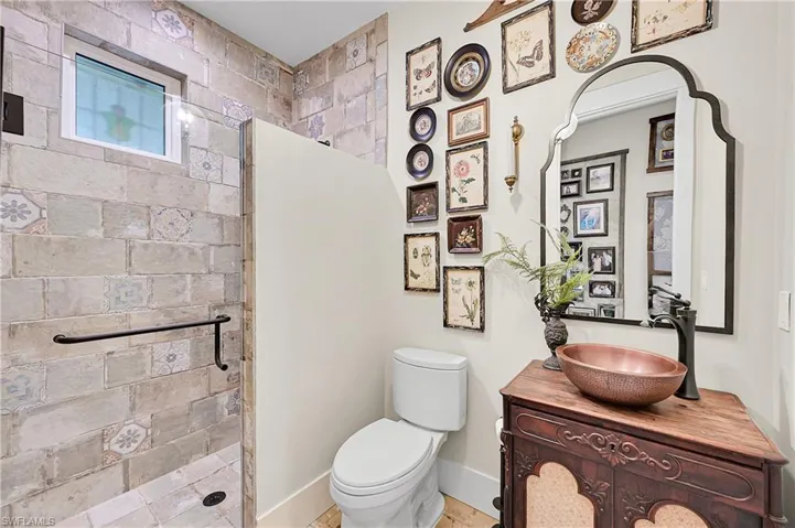 Ground floor full bath convenient for guests staying in the library or lounging in the outdoor living room