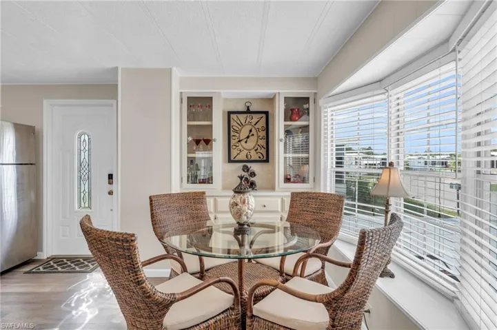 Dining space with built in shelves and large bay window