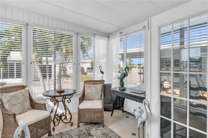 View of sunroom with beautiful tile floors and french doors
