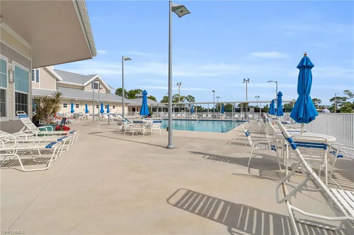 View of pool featuring a large patio and sun deck