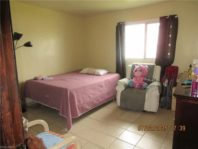 Bedroom with tile patterned flooring