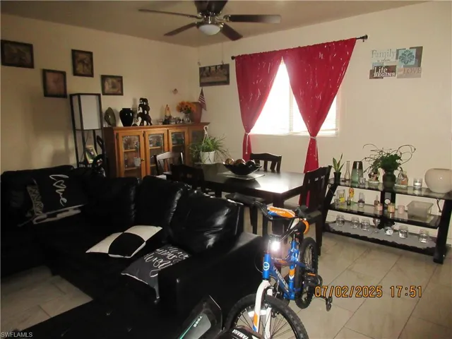 Dining space with ceiling fan and tile patterned flooring