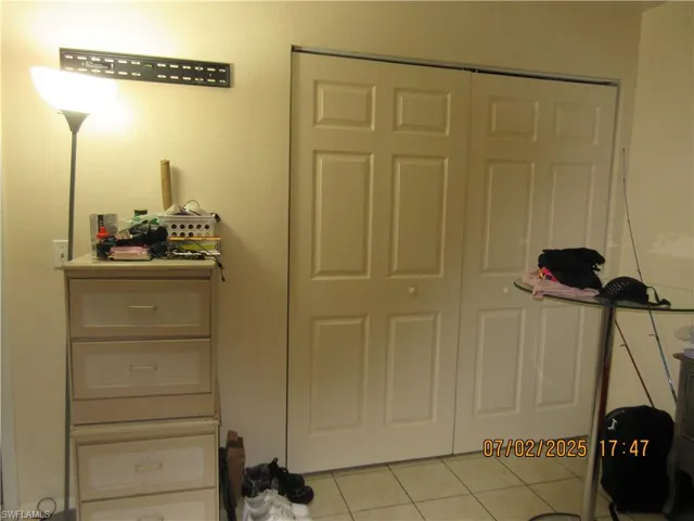 Bedroom featuring light tile patterned floors