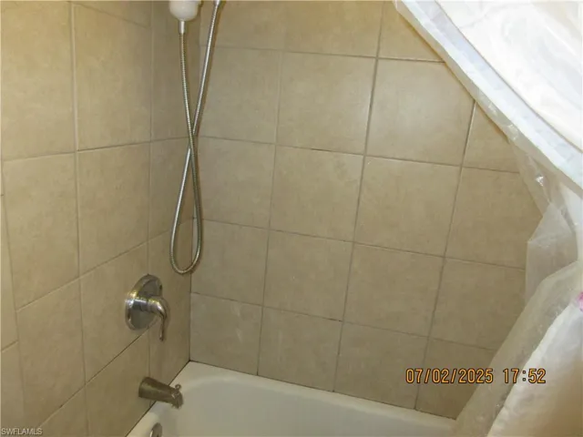 Bathroom featuring shower / bathtub combination