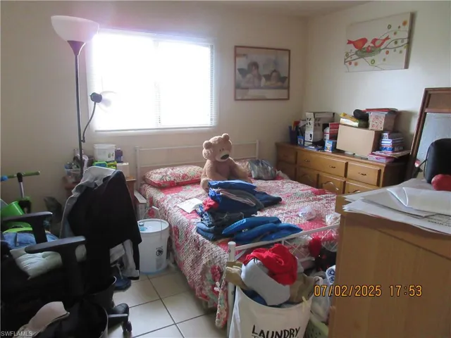 Bedroom featuring light tile patterned floors