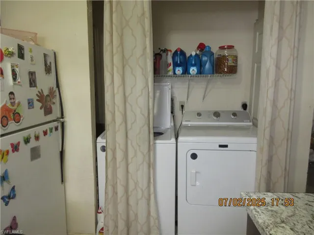 Washroom with washing machine and dryer