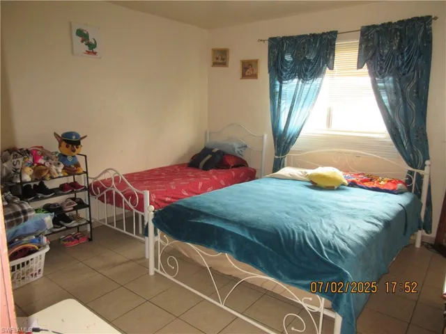 Bedroom with tile patterned flooring