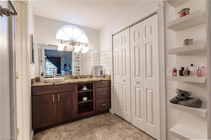 Bathroom featuring plenty of natural light and vanity