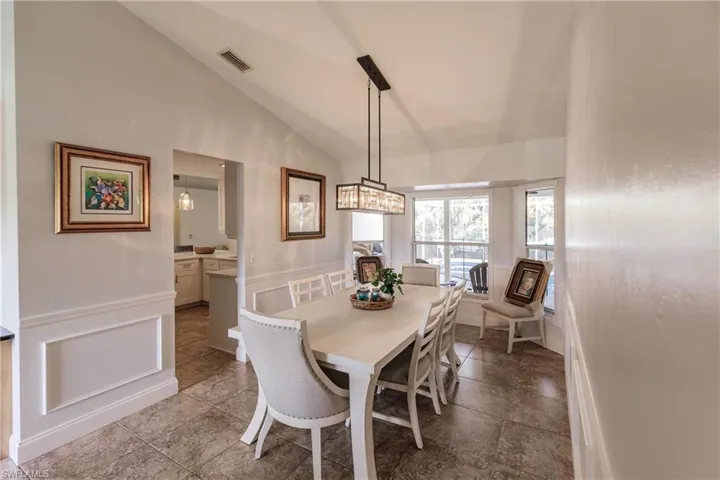 Formal Dining area with high vaulted ceiling