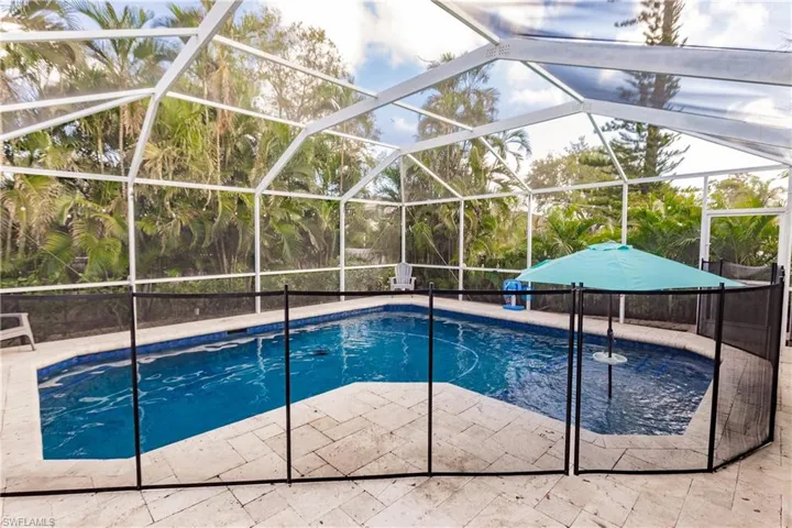 View of pool featuring a patio and a lanai