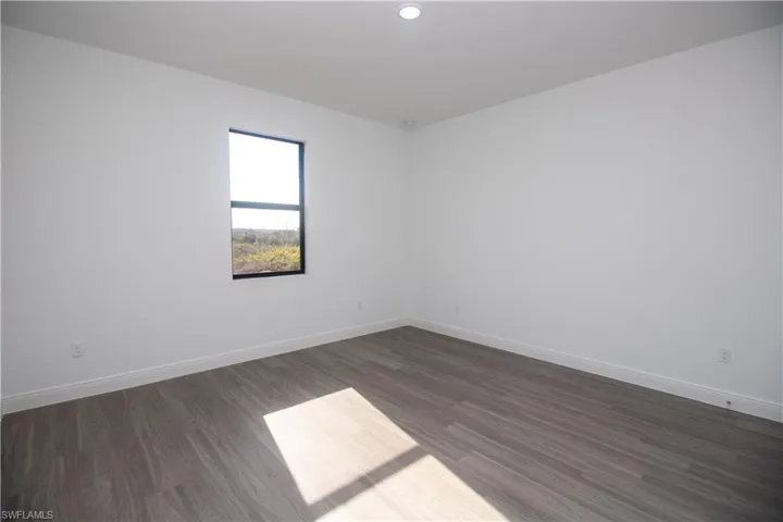 Master bedroom featuring vinyl-type flooring