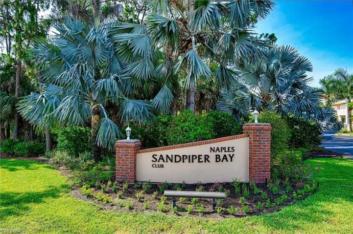 Community sign featuring a yard