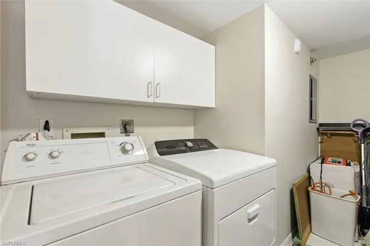 Laundry area with washer and dryer and cabinet space