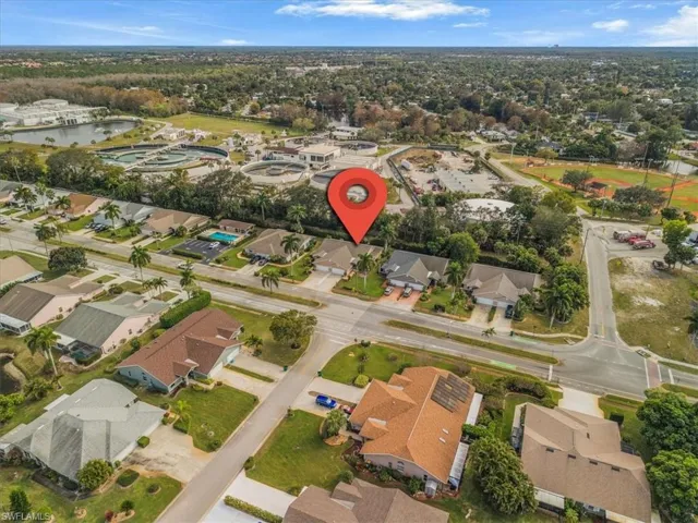 Aerial overview of property's location with nearby suburban area