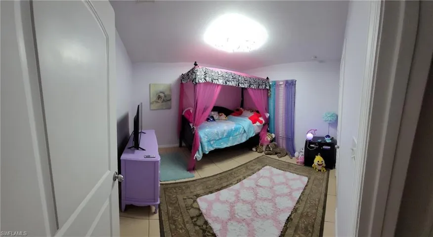 Bedroom featuring tile flooring