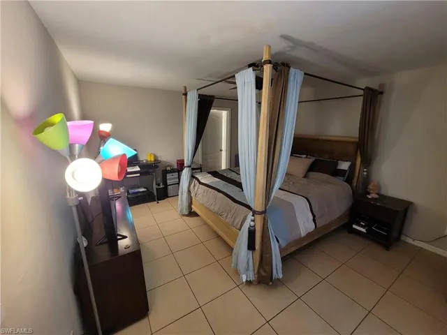 Bedroom with tile flooring