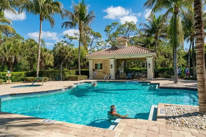 Community pool with a patio area