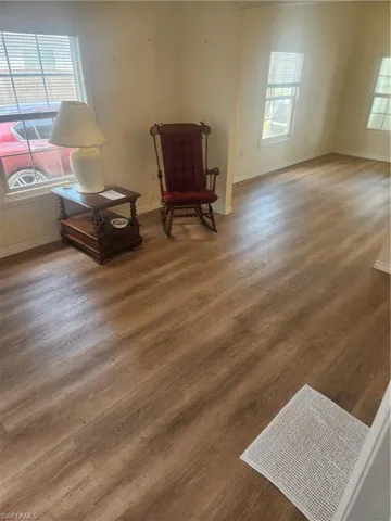 Living area featuring wood finished floors and baseboards