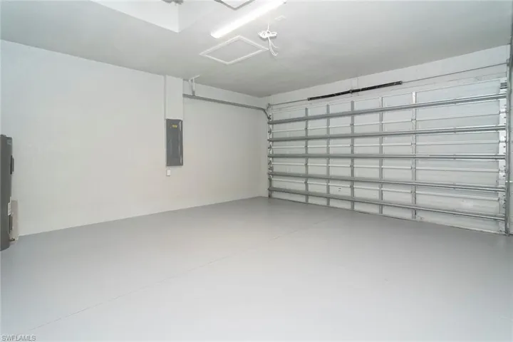 Garage with electric panel and water heater